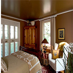 Wooden wardrobe, bed, and chair