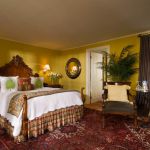 High bed in a bright yellow room