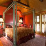 4 post bed in a rustic room