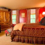 Cozy looking bedroom with an ornate bedspread