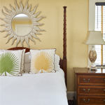 Bright bedroom with sun shaped mirror