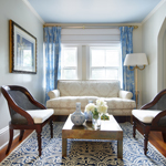 A couch and 2 chairs around a coffee table