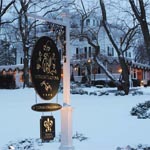 The sign of The Homestead Inn during the winter holidays